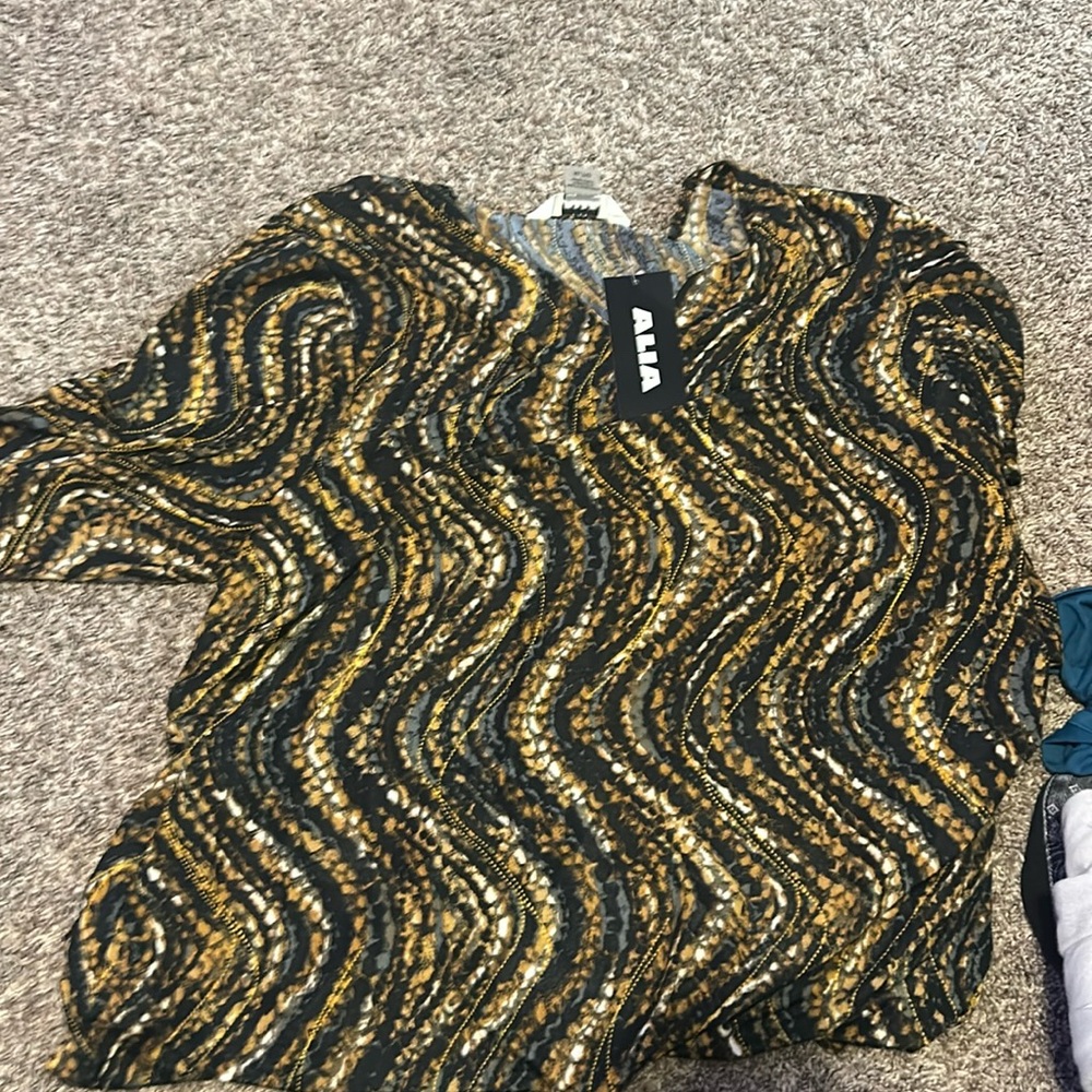 gold, black, and grey long sleeve